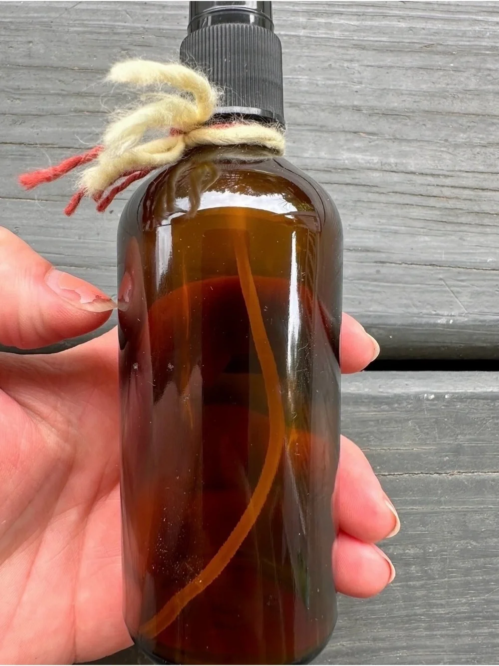 Brown Glass Spray Bottle with Decorative Colored Yarn for Accent- like new